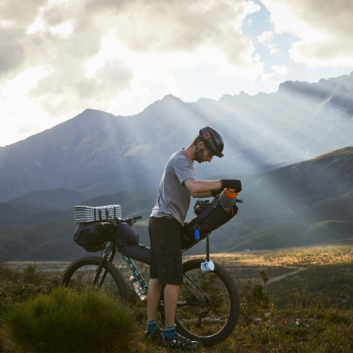 Off-Road Seat Pack Medium designed for weekend adventures, featuring waterproof construction, M.O.L.L.E. attachment system, and a stable adjustable rack for secure fitting.