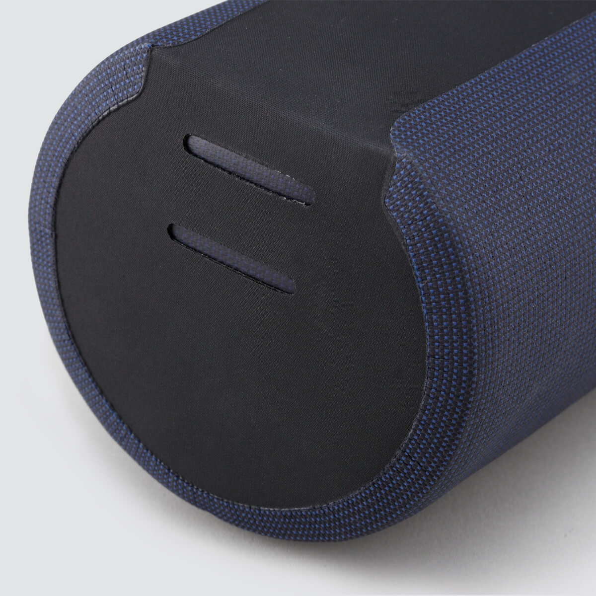 Off-Road Bottle Pouch designed to securely hold a large bottle or snacks, featuring roll top for weather protection and durable fabric for outdoor use.