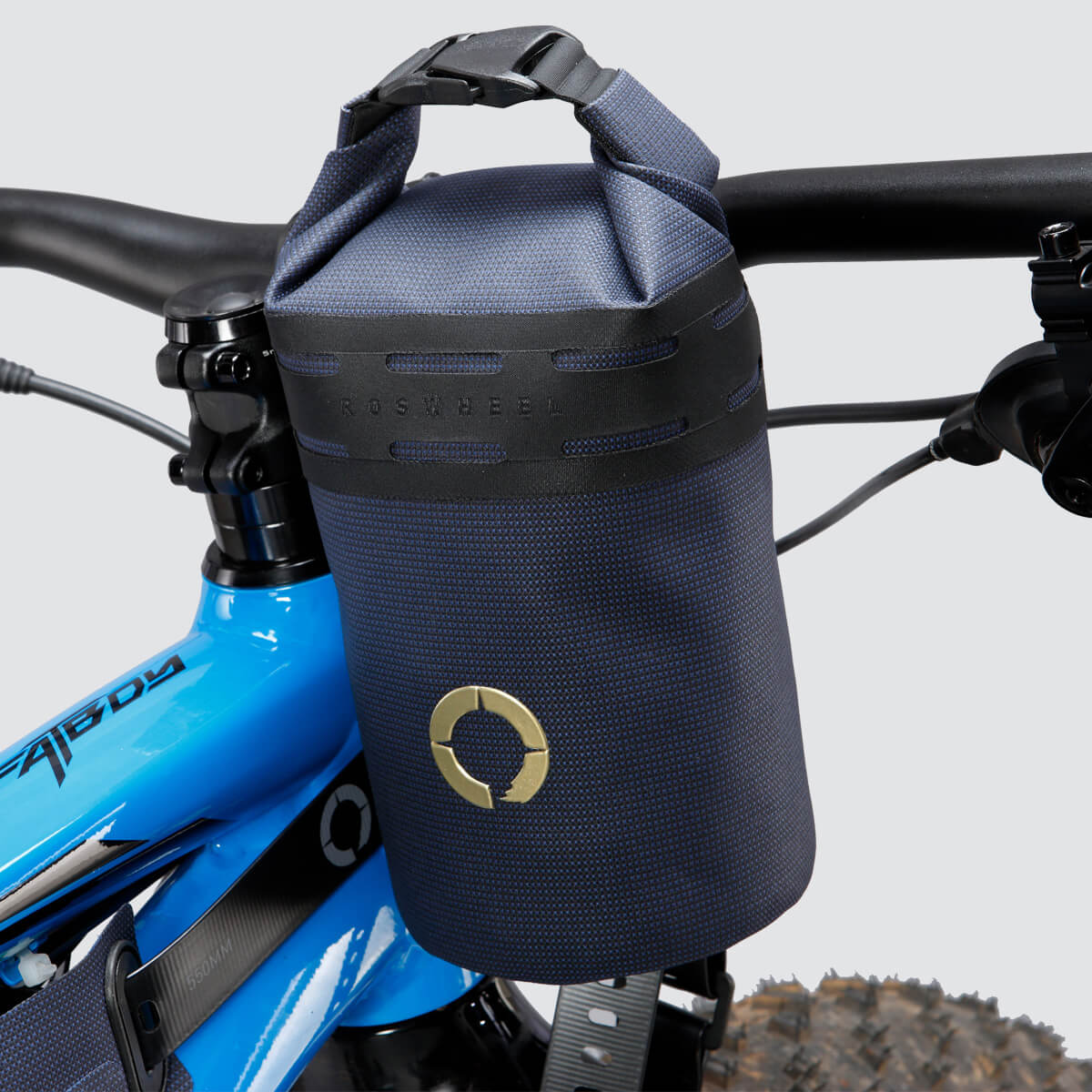 Off-Road Bottle Pouch designed to securely hold a large bottle or snacks, featuring roll top for weather protection and durable fabric for outdoor use.