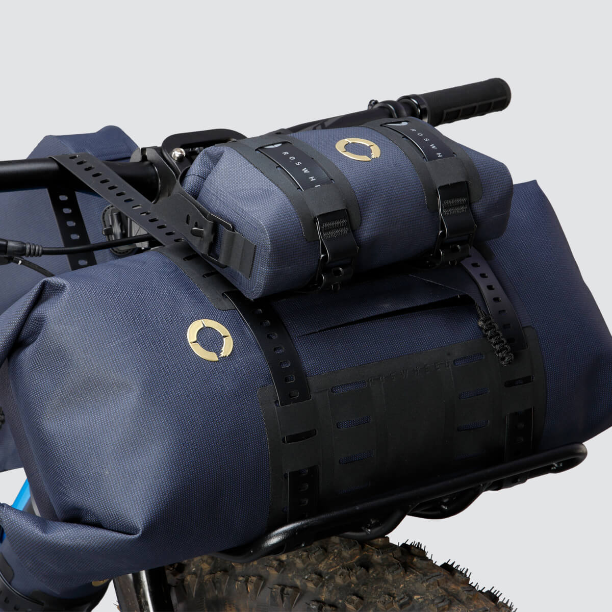 Off-Road Tool Pouch with waterproof design, inner zip pocket for organization, and M.O.L.L.E. system for flexible attachment options on the bike.