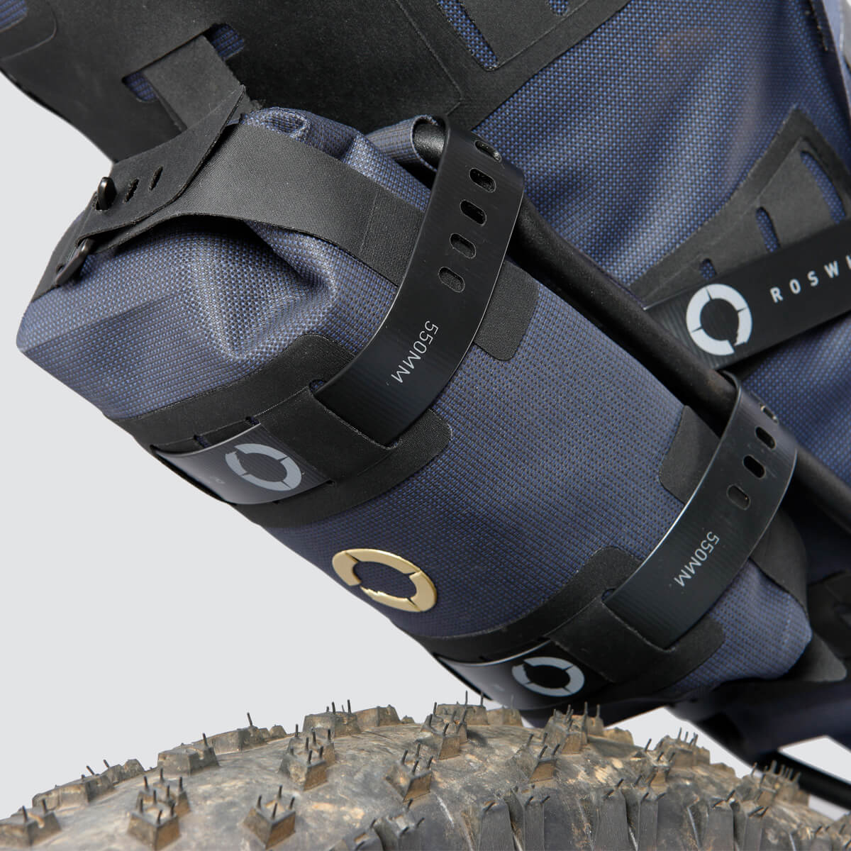 Off-Road Tool Pouch with waterproof design, inner zip pocket for organization, and M.O.L.L.E. system for flexible attachment options on the bike.