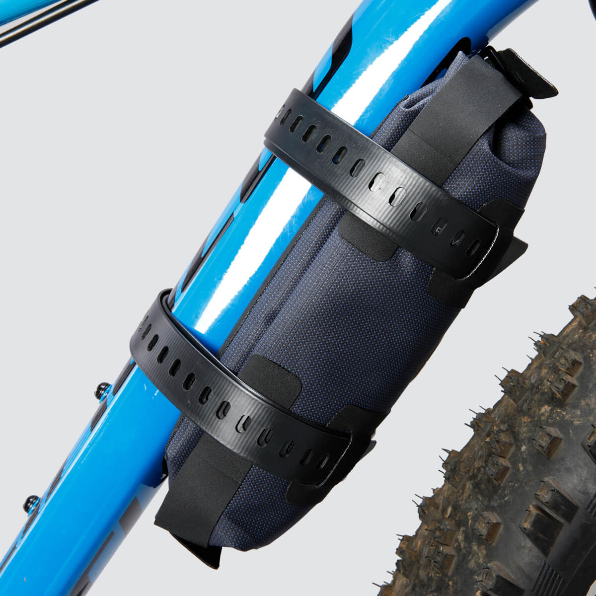 Off-Road Tool Pouch with waterproof design, inner zip pocket for organization, and M.O.L.L.E. system for flexible attachment options on the bike.