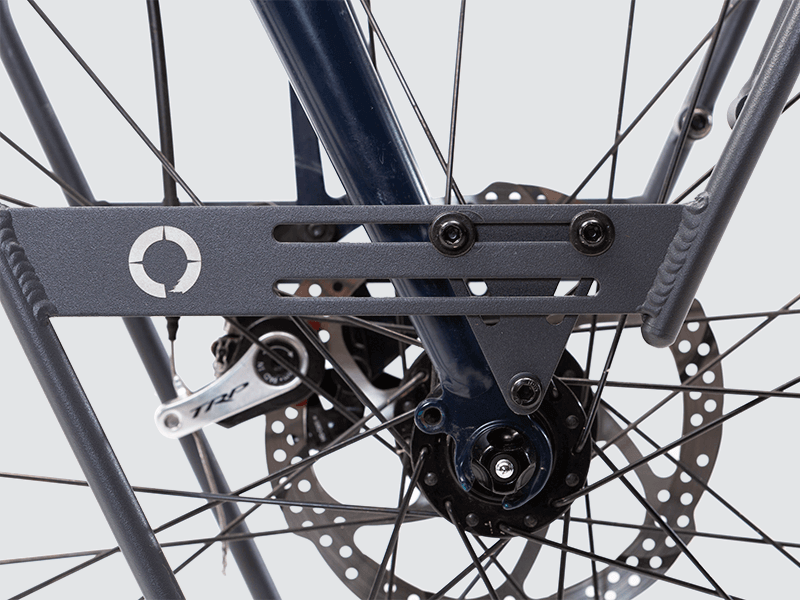 Tour front rack for balanced load carrying, compatible with most disc brake bikes and forks.