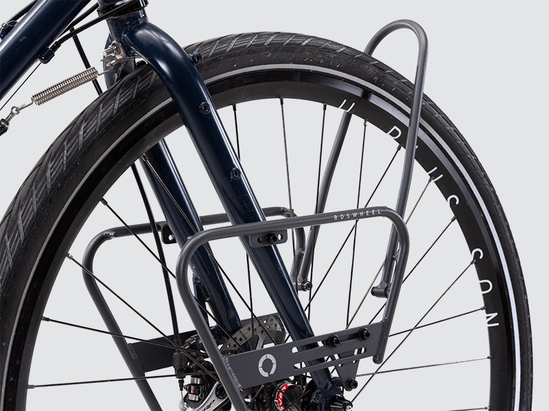 Tour front rack for balanced load carrying, compatible with most disc brake bikes and forks.