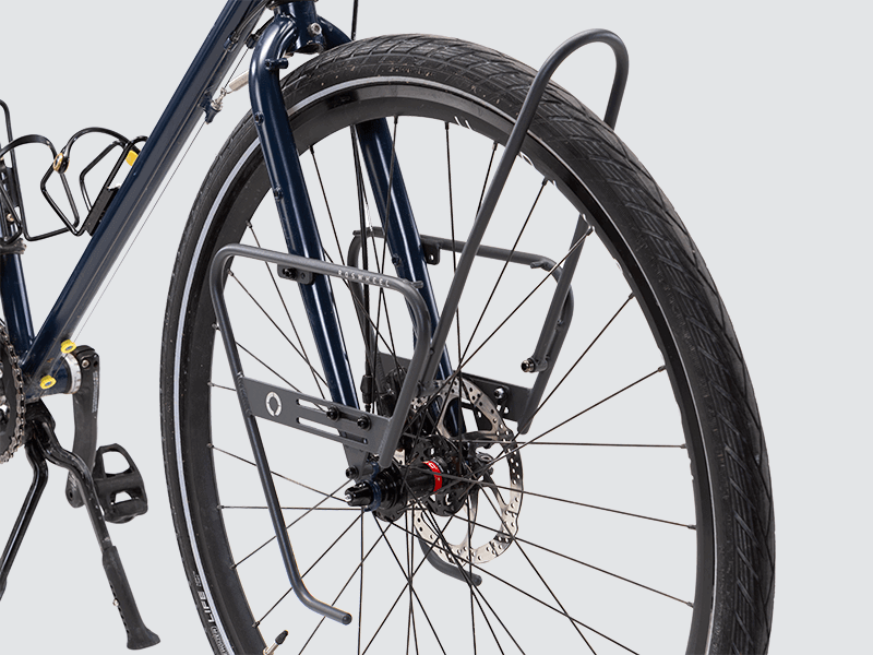 Tour front rack for balanced load carrying, compatible with most disc brake bikes and forks.