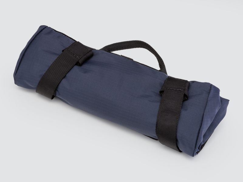 Water-resistant Tour Lightweight Pannier designed for touring, featuring a semi-rigid structure and flexible attachment system for secure fitting.